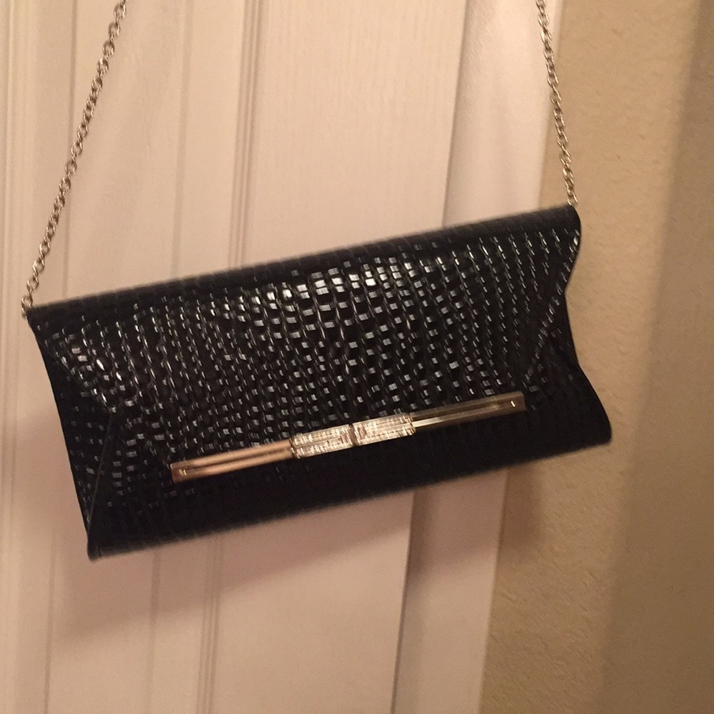 Black faux croc clutch purse with jeweled accents.